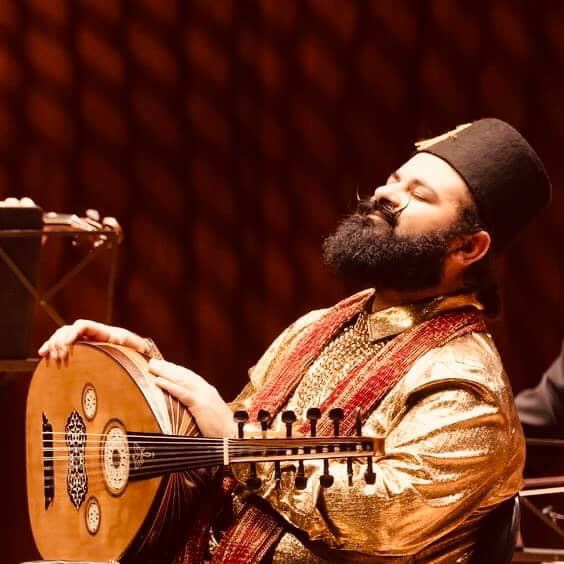 Joseph Tawadros in black fez with the Australian Chamber Orchestra