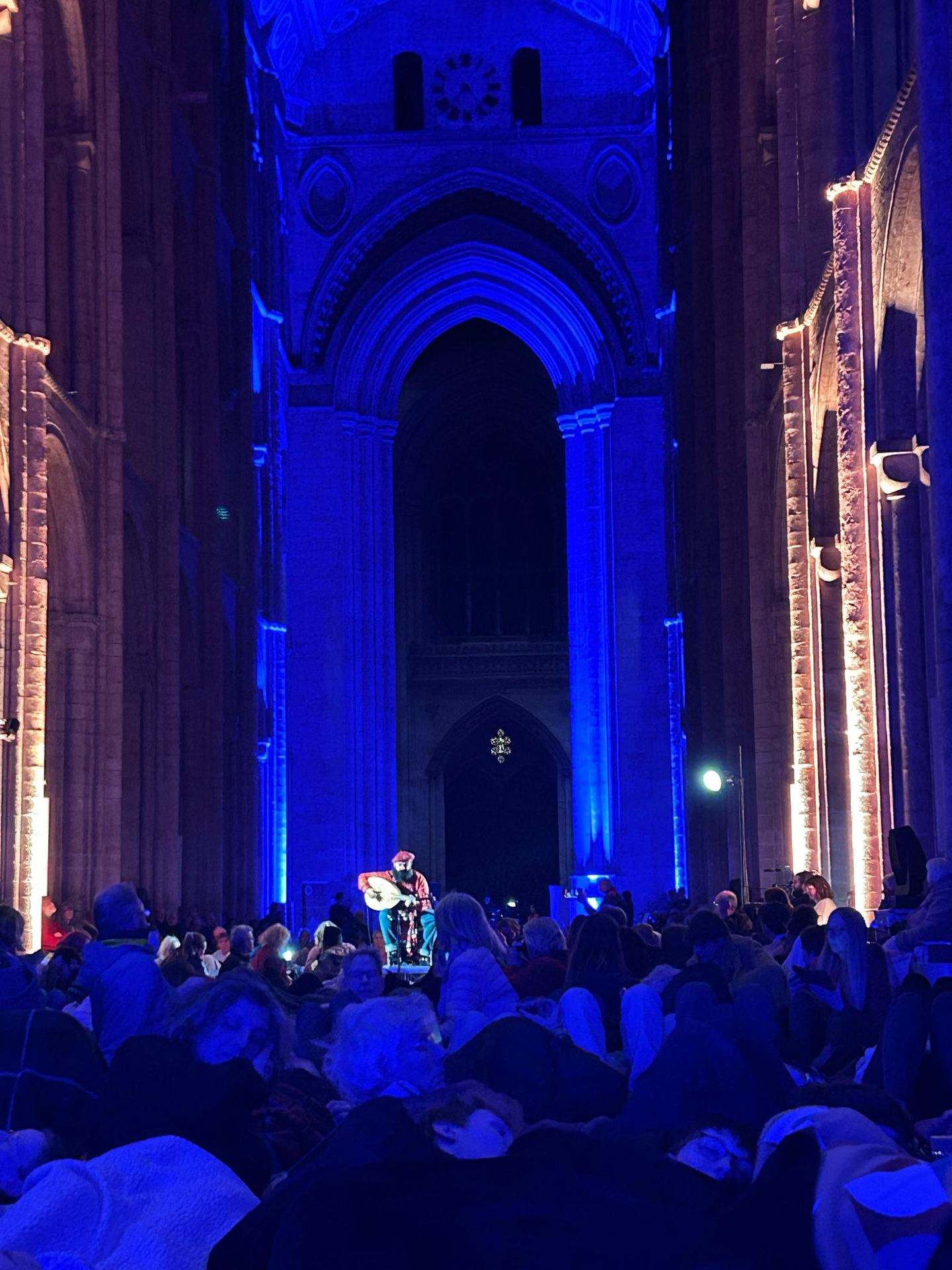 Joseph Tawadros performing oud in a cathedral with Britten Sinfonia