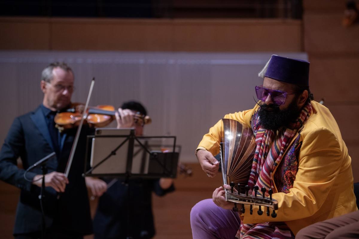 Joseph Tawadros on stage with oud